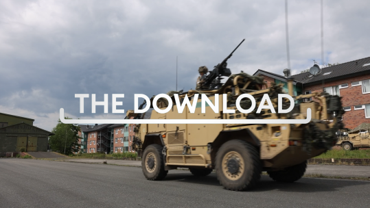 Armoured vehicle on street with Download graphic