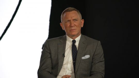 Daniel Craig being interviewed by a member of the Royal Navy ahead of the upcoming James Bond film 'No Time To Die'