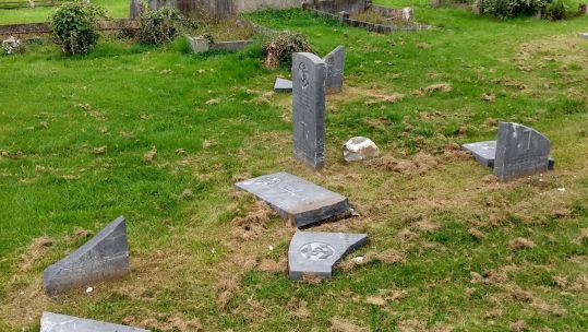 Defaced war graves at Belfast City Cemetery (Picture: CWGC).