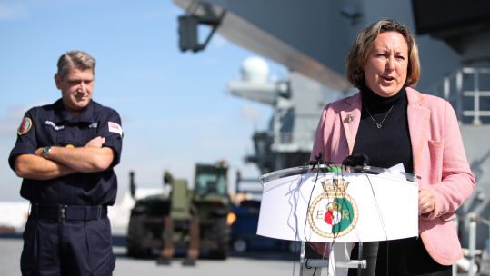 Defence Minister Anne-Marie Trevelyan and Commodore Mike Utley on the flight deck of HMS Queen Elizabeth 230819 CREDIT PA