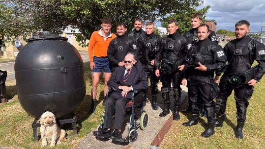 Divers at Portsmouth met with WW2 bomb disposal expert Boyd Salmon and replaced the medals he had lost (Picture: Royal Navy)