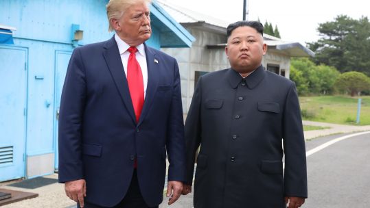 US President Trump and North Korean leader Kim Jong Un during Mr Trump's visit in June (Picture: PA).