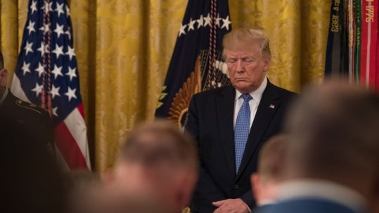 Donald Trump standing with his head bowed 250619 CREDIT US ARMY.jpg