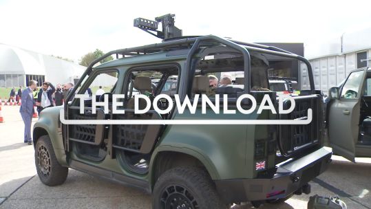 green military vehicle with download graphic