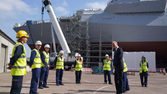 Duke of Cambridge, Prince William in Scotland, chats to workers as they view construction work on HMS Glasgow during a visit to the BAE Systems shipyard 29062021 CREDIT ALAMY