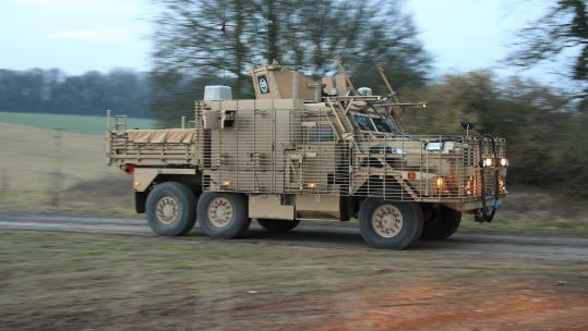 Wolfhound Armoured Vehicle TSV 6X6 traveling at speed during an early morning exercise