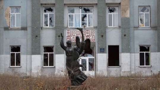 A building at a town in Kherson Oblast near the front line was damaged by Russian artillery