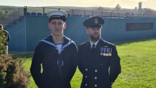 Engineering Technician George Hunter with his father WO2 Graham Hunter who served on the same Astute Class submarine (Picture: Royal Navy).