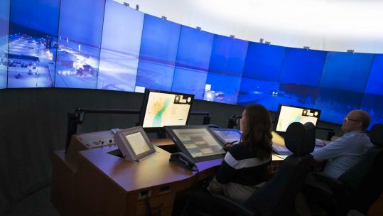Example of how remote air traffic control modules at RNAS Culdrose could look on curved screen wall 22021 CREDIT Saab.