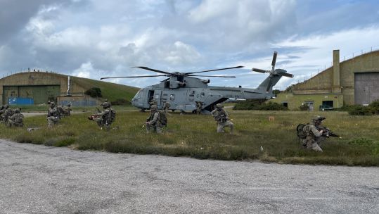 Members of 45 Commando disembark from a Mark 4 Merlin helicopter on Ex Merlin Storm