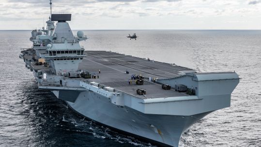 F-35 above HMS Queen Elizabeth 131019 CREDIT MOD.jpg