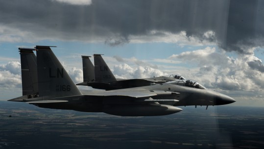Two 48th Fighter Wing F-15C Eagles, based at RAF Lakenheath, fly over UK