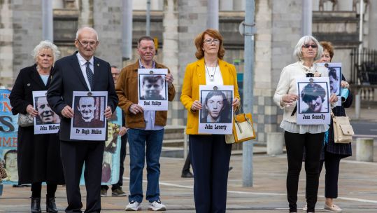 Cover image: Families of the people killed at Ballymurphy in 1971 held their pictures outside the court (Picture: PA/Alamy).