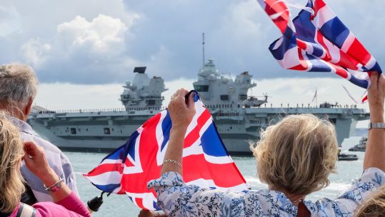 Families wave from Round Tower as HMS Prince of Wales departs for her autumn deployment 01092023 CREDIT MOD.jpg