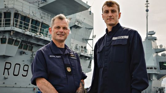 Father and son duo Engineering Technician Ashley Smith and his dad Warrant Officer 2 Duncan Thornhill on HMS Prince of Wales 170521 CREDIT ROYAL NAVY
