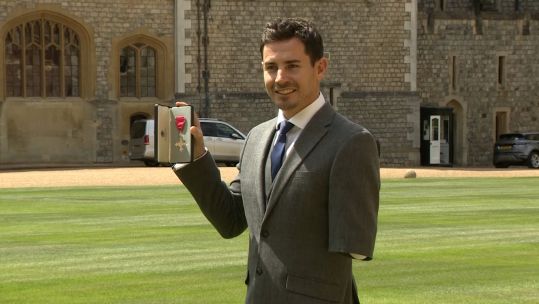 Former Paratrooper Jaco van Gass at Windsor Castle after being awarded an MBE by Prince Charles