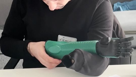Former Ukrainian Soldier Vitalli Ivashuk looking at open bionics 'hero arm' 13012023 Credit Open Bionics