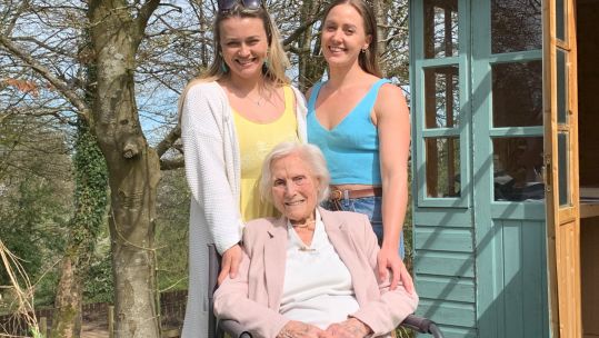 Fundraising veteran Marjorie Lamb with her granddaughters 240420 CREDIT BFBS
