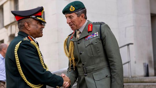 General Gwyn Jenkins right shaking hands with General Manoj Pande Picture MOD.jpg 