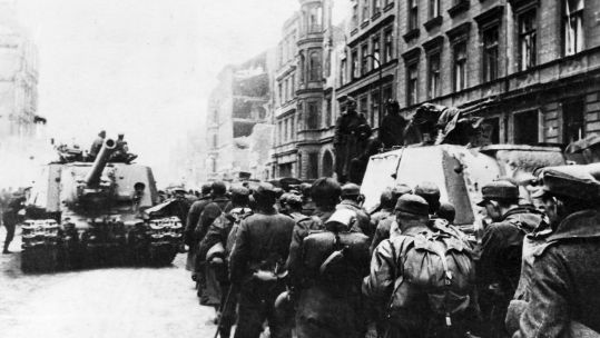 Cover image: German soldiers are captured by Russian forces at the end of the war in Berlin, a week before VE Day (Picture: PA).