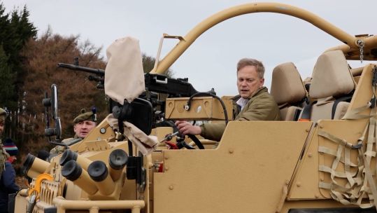 Then-Defence Secretary Grant Shapps gets behind the wheel of a Jackal
