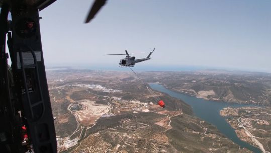 Griffin helicopter from 84 Squadron practicing firefighting skills.