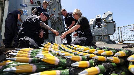 Gunners prep the 30mm rounds for the DS-30M Mk II deck gun