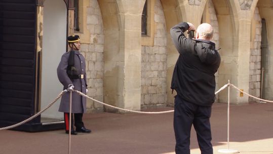 Rajan Rana being photographed while on duty.