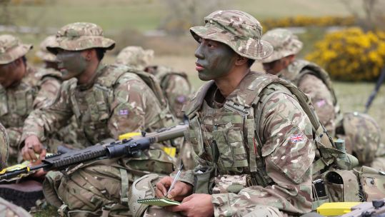 Gurkhas listen to their instructor