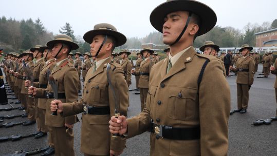 Gurkhas standing to attention with their iconic Kukris drawn (Picture: BFBS)