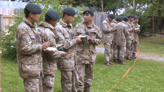 Gurkha recruits take notes on urban warfare.