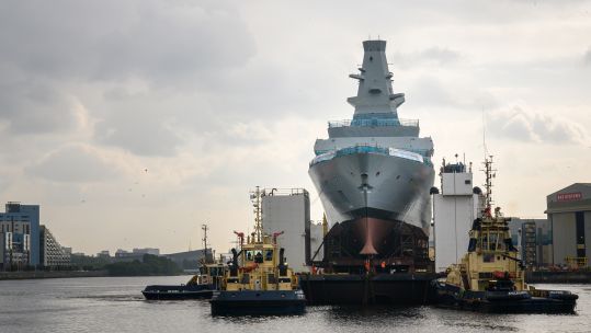 HMS Cardiff leaves the Govan shipyard on a barge to begin the float-off process (Picture: BAE Systems)