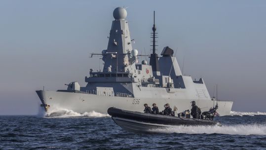 Cover Image: HMS Defender and its detachment of Royal Marines travelling in a sea boat (Picture: Royal Navy).