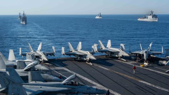 HMS Duncan steams in formation with the Dwight D Eisenhower Carrier Strike Group and the Wasp Amphibious Ready Group (Picture: US Fleet Forces)