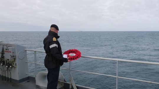 HMS Echo's Commander Coles prepares to cast wreath with the Marshal Ustinov a few hundred yards away 20092021 Credit Royal Navy.jpg