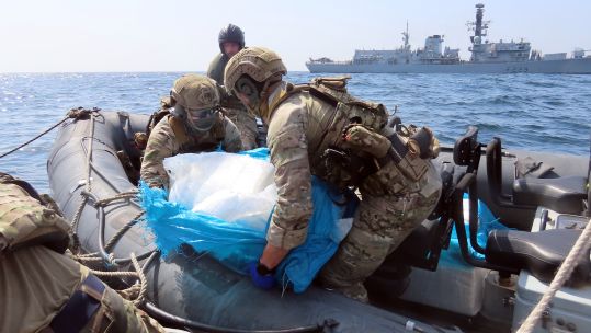 HMS Lancaster Royal Marines Boarding Team remove seized weapons from the vessel 01032023 CREDIT MOD Crown Copyright