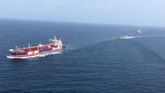 Cover Image: HMS Montrose escorts two British ships through the Strait of Hormuz in July, last year (Picture: Royal Navy).