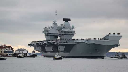 Cover image: Library picture of HMS Prince of Wales in Portsmouth (Picture: PA).