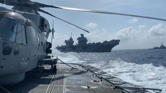 HMS Prince of Wales, seen here from HMS Richmond, is leading the vessels on CSG25 on their eight-month deployment