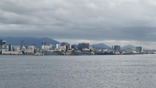 HMS Protector sails past ex-HMS Ocean PMH Atlantico in Brazil fuel stop 01112021 Credit HMS Protector Twitter
