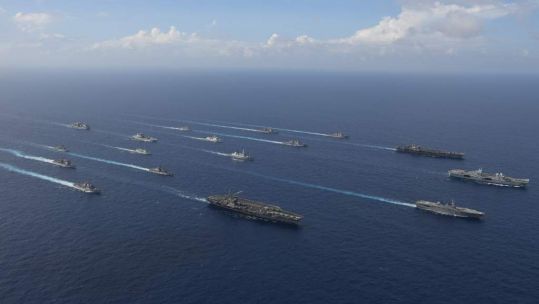 HMS Queen Elizabeth alongside aircraft carriers from both Japan and the US during a joint exercise whilst on the CSG21 deployment
