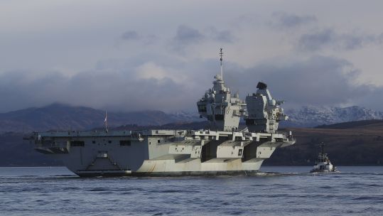 Cover image: HMS Queen Elizabeth last month arriving at the new £64m Northern Ammunition Jetty in Scotland for final preparations ahead of her first operational deployment (Picture: Royal Navy).
