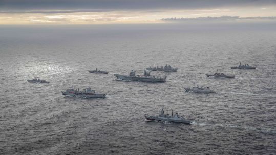 HMS Queen Elizabeth during Exercise Joint Warrior surrounded by other vessels as Carrier Strike Group forms