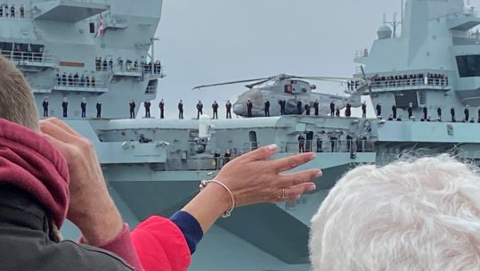 HMS Queen Elizabeth is waved off as she departs Portsmouth for her maiden deployment.