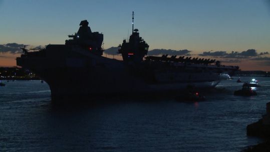 HMS Queen Elizabeth leaves Portsmouth at night for first operational deployment, Carrier Strike Group 21 220521 CREDIT BFBS