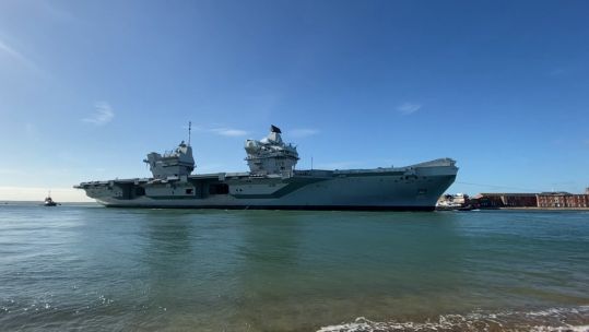 HMS Queen Elizabeth returns to Portsmouth with tugs 151020 CREDIT BFBS