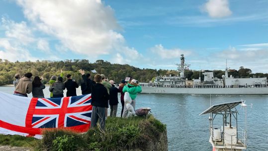 Crowds gather at Devil's Point to see off the submarine-hunter (Picture: MOD) 