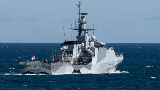 HMS Spey leaving Falmouth Harbour with dazzle paintwork 040621 CREDIT BOB SHARPLES ALAMY 2.jpg