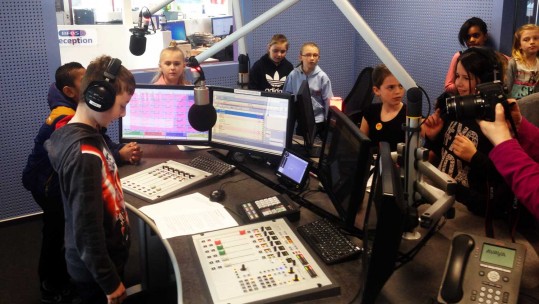 Haig School student records his radio advert at BFBS as part of a school project
