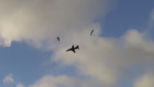Hawk T1 flies close to paragliders